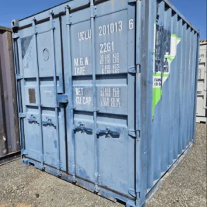 Blue used 10ft container with a welded lockbox, stencilled owner code and closed cargo doors