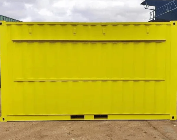 Side elevation of a yellow converted container showing two closed hatch openings