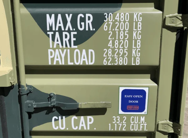 Weight and capacity markings stencilled onto a camouflage painted container door
