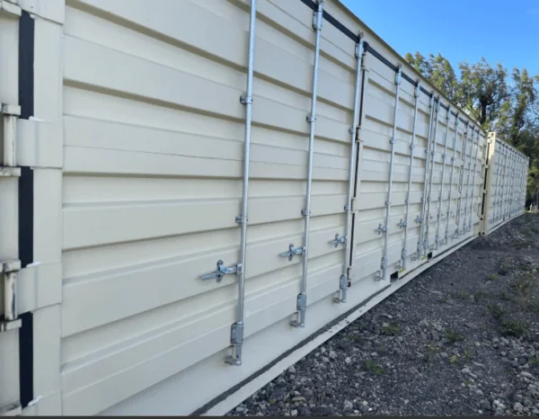 Looking along the locking bars of the side doors on an open side container
