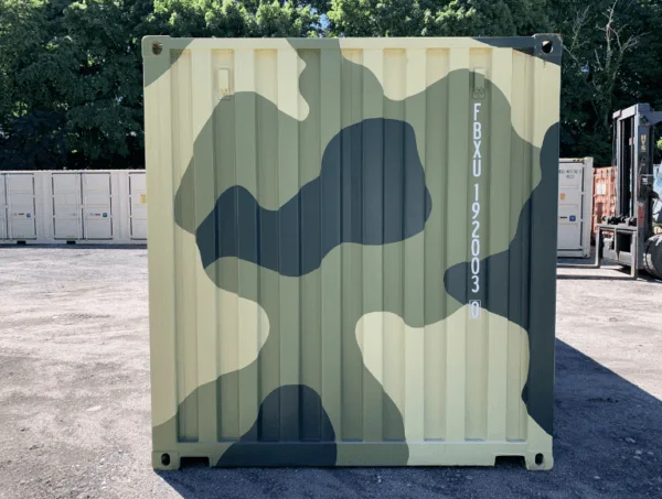 End wall of a 20ft container finished in green and sand camouflage paint