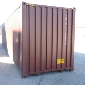 Brown 40ft container viewed from its closed end on a sunlit yard