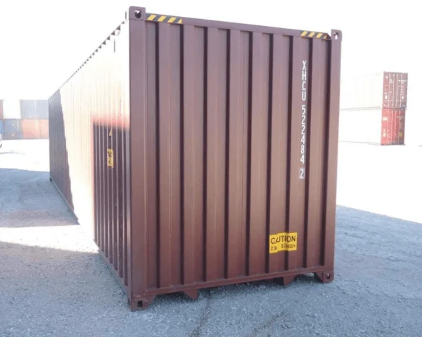 Brown 40ft container viewed from its closed end on a sunlit yard
