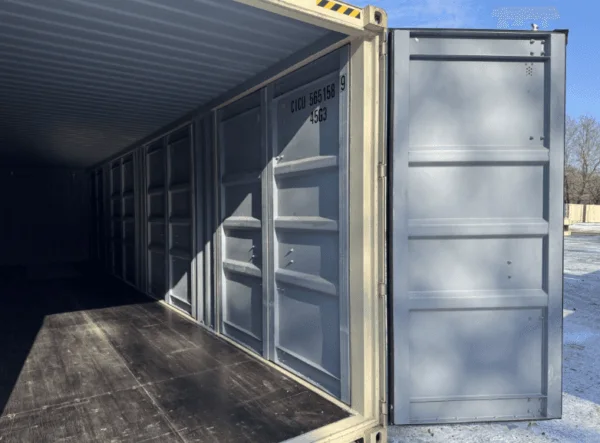 Side door open on a beige container showing the dark floor and lined walls
