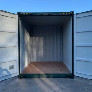 Green 10ft container with both doors open, showing the white lining and plywood floor