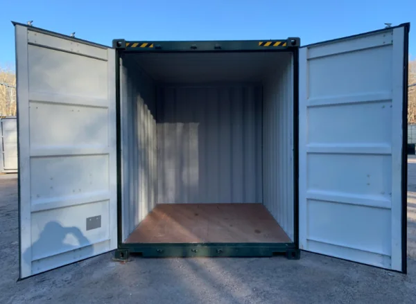 Green 10ft container with both doors open, showing the white lining and plywood floor