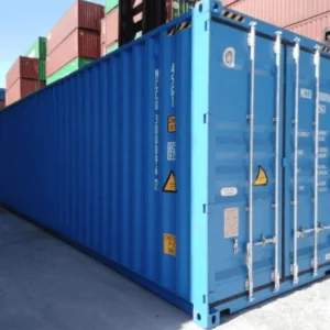 Blue 40ft high cube container seen down its full length in a stacked container yard