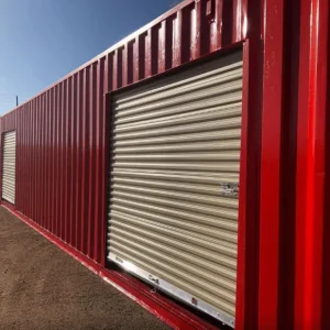 Red container with a cream roller shutter door set into its long side