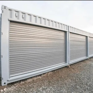 White container fitted with a row of separate roller shutter doors along its side