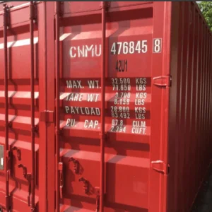 Dark red open top container showing its cargo door end and weight markings