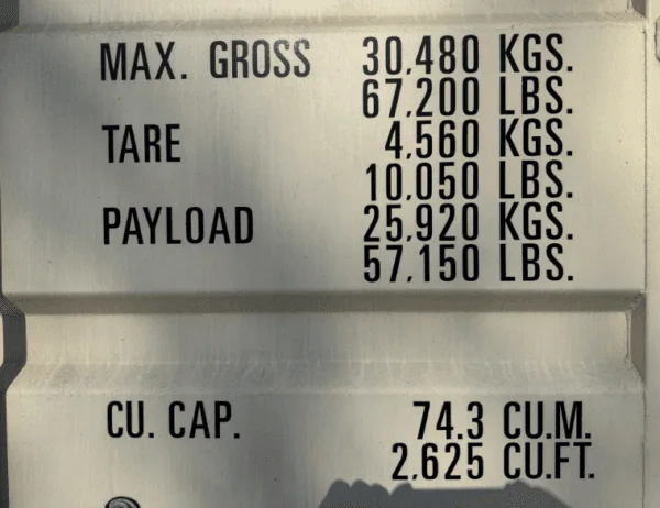 Gross weight, tare and capacity markings stencilled on a beige container