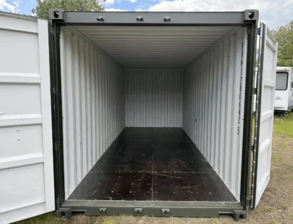 Doors swung wide on a green 20ft container, looking the length of the empty interior