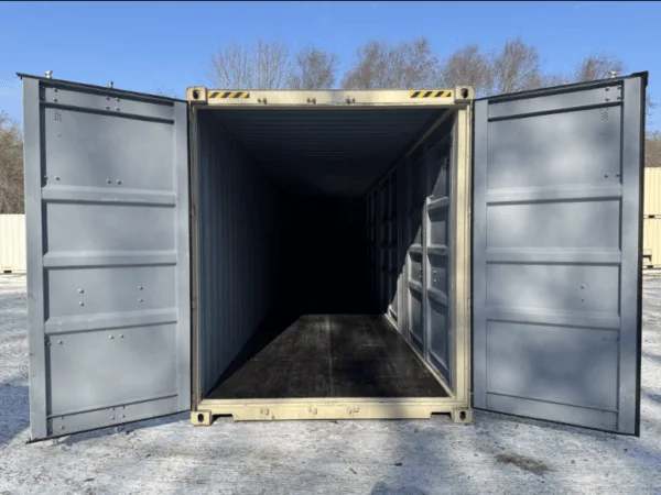 Doors open at both ends of a beige container, giving a clear view straight through