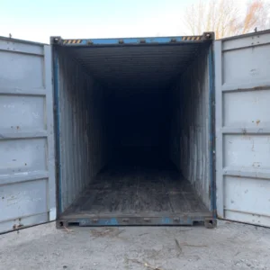 Used blue 40ft container with doors open onto its long weathered interior