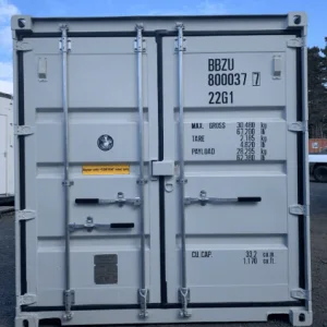 Light grey 20ft container photographed square on to its closed cargo doors
