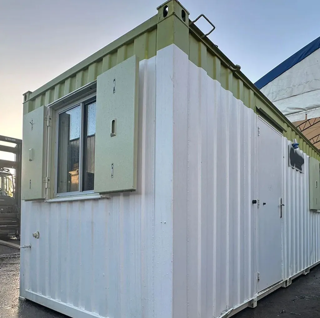 Exterior of a container office cabin with sliding windows and steel shutters