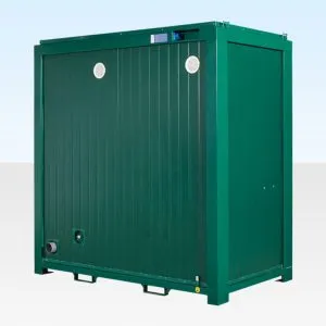 Green steel double toilet cabin viewed from the front corner, mounted on a skid base