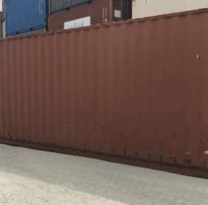 Rust brown used 40ft container seen along its full length in a yard
