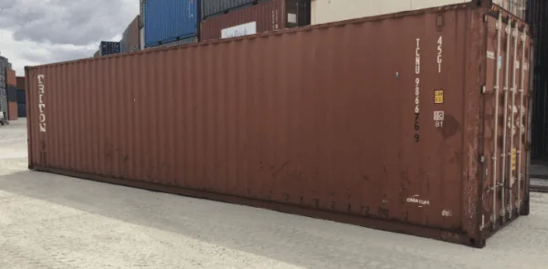 Rust brown used 40ft container seen along its full length in a yard