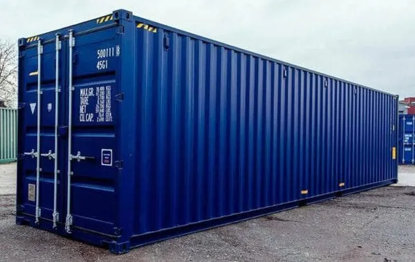 Blue 40ft high cube container standing on a yard with its cargo doors closed