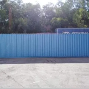 Light blue 40ft container seen along its full side in a container yard