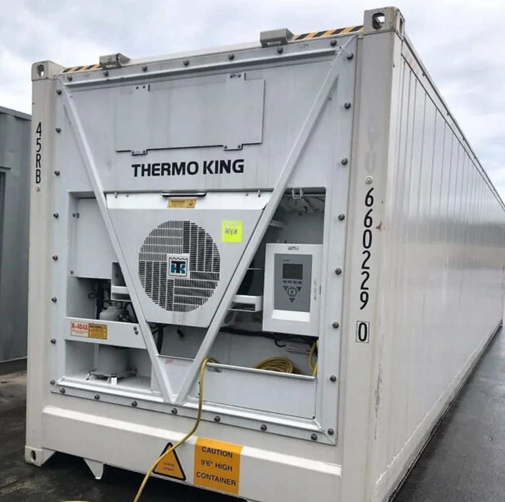 Thermo King refrigeration unit filling the end wall of a white reefer