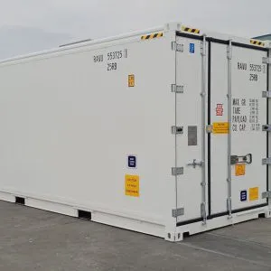 White one trip refrigerated container seen from the corner at a depot